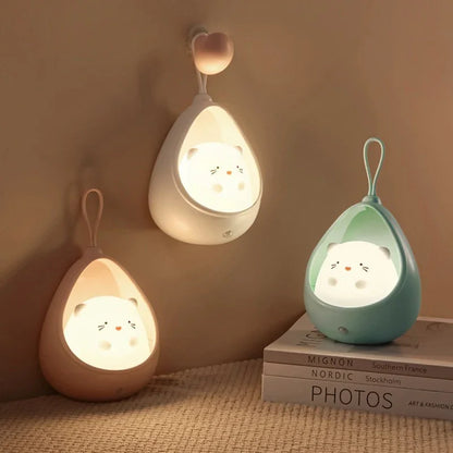 Three cute night lights shaped like teardrops on a textured surface with a neutral background.