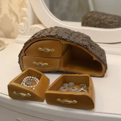 Jewelry organizer with drawers on a decorative surface