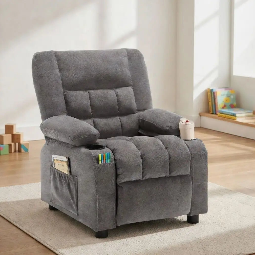 Gray recliner chair with cup holder and magazine rack in a room with toys and books.