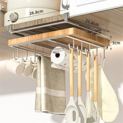 Kitchen cabinet organizer with hanging utensils, towels, and a paper towel holder.