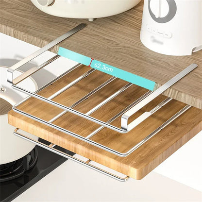 Wooden cutting board with metal holder on a kitchen counter
