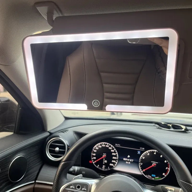 Car interior with a mounted tablet displaying a rearview mirror view.