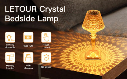Crystal bedside lamp with features listed on a dark surface