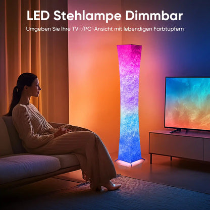 Woman sitting on a couch in a living room with an LED floor lamp and TV.