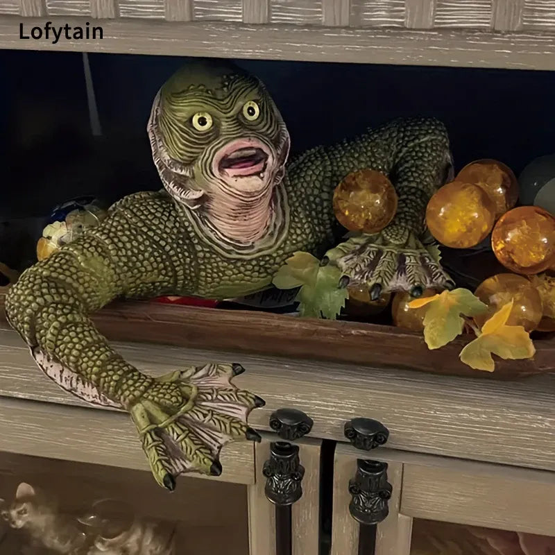 Green creature with large eyes and open mouth peeking out from behind a wooden cabinet.