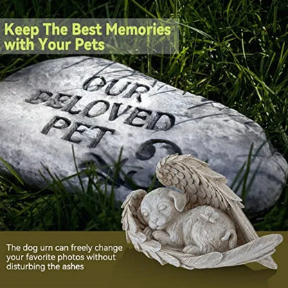 Memorial stone with 'Our Beloved Pet' engraved, featuring a dog urn with an angelic design on grass.