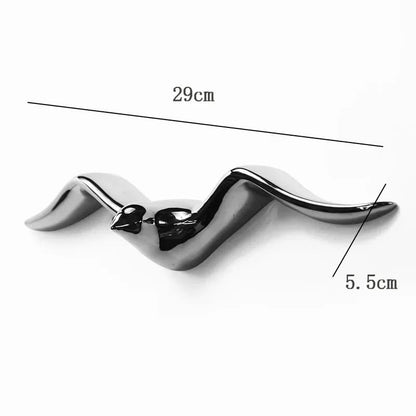 Metallic Bird wall art piece with measurements on a white background