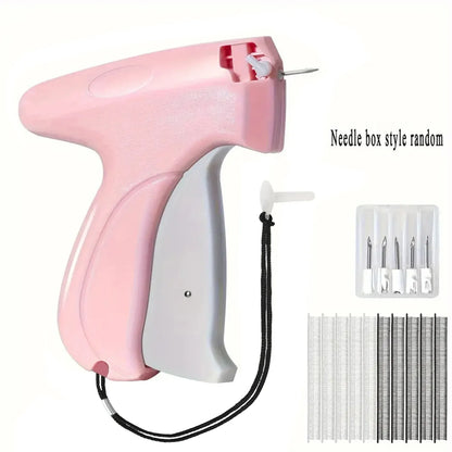 Pink and white garment tagging gun with needle set on a white background