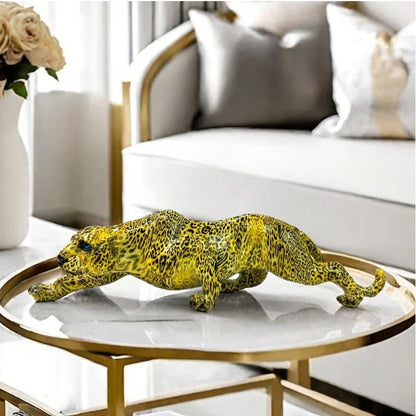Yellow leopard figurine on a round glass table in a living room setting