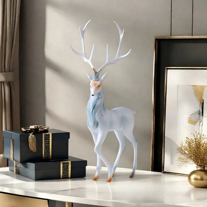 Modern Deer Sculpture on a table with gift boxes and a framed picture in the background.