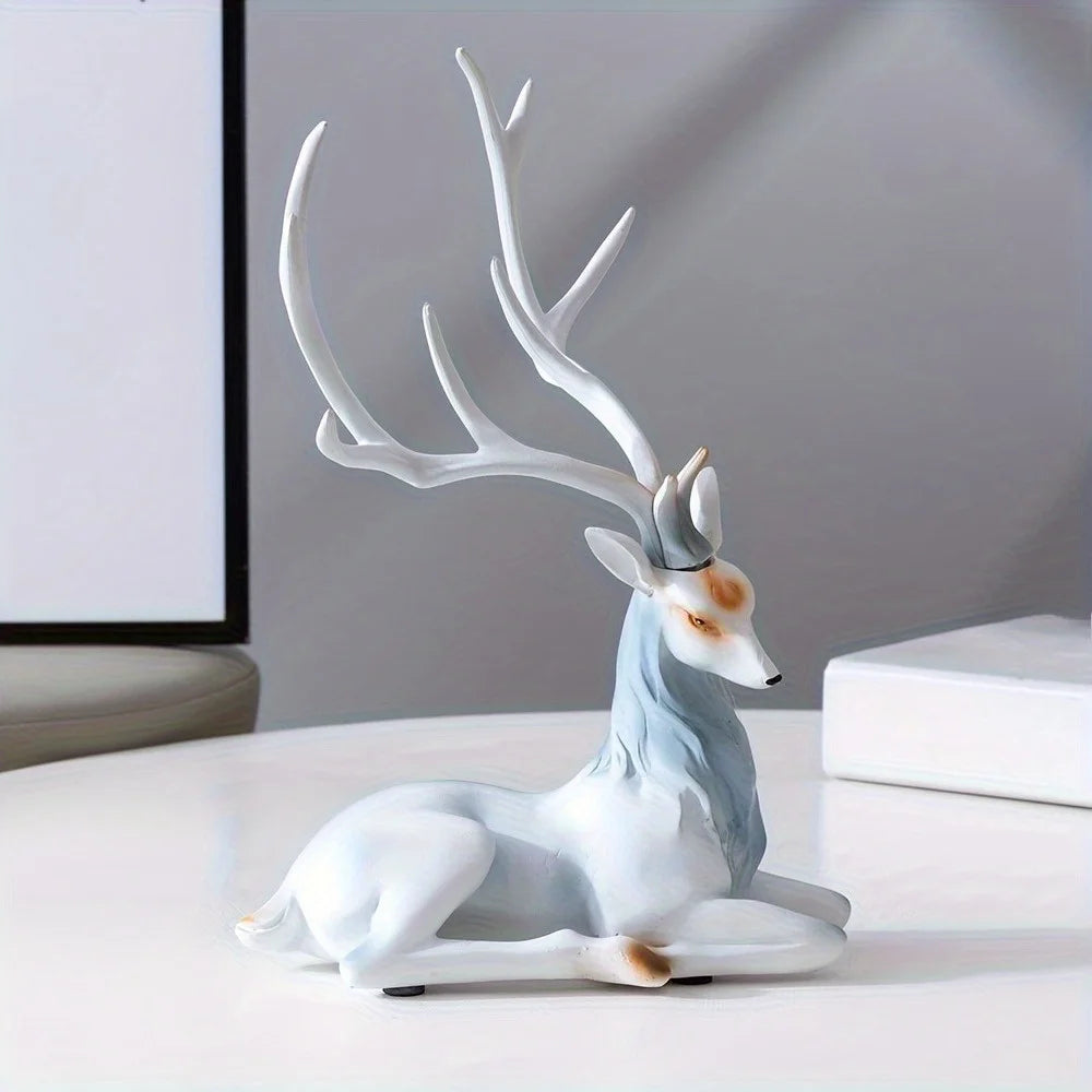 Modern Deer Sculpture with white antlers on a light surface.