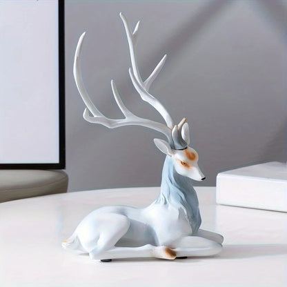 Modern Deer Sculpture with white antlers on a light surface.