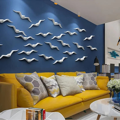 Modern living room with yellow sofa, decorative pillows, and wall art of white birds.