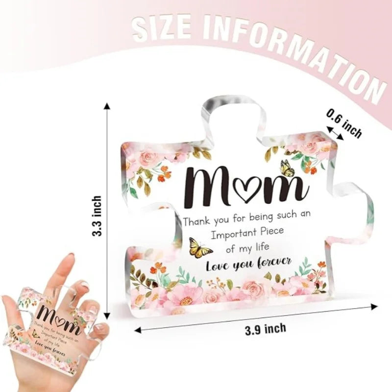 Clear acrylic block with floral design and text, held by a hand, with size information displayed.