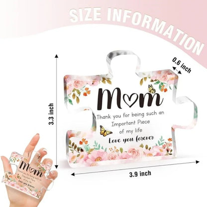 Clear acrylic block with floral design and text, held by a hand, with size information displayed.