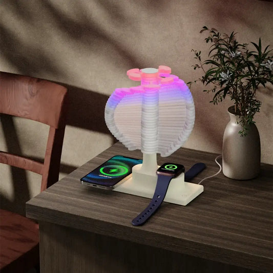 Multicolored LED lamp on a wooden table with a phone and a smartwatch.