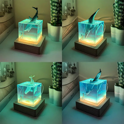 Table lamp with shark design in a block of ice on a wooden base, glowing in a room setting.