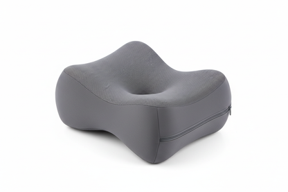 Orthopedic memory foam knee pillow flat lay showing ergonomic contoured shape and breathable zippered cover detail