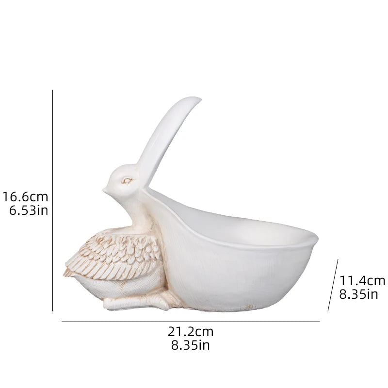 Decorative white bird-shaped bowl with measurements on a white background