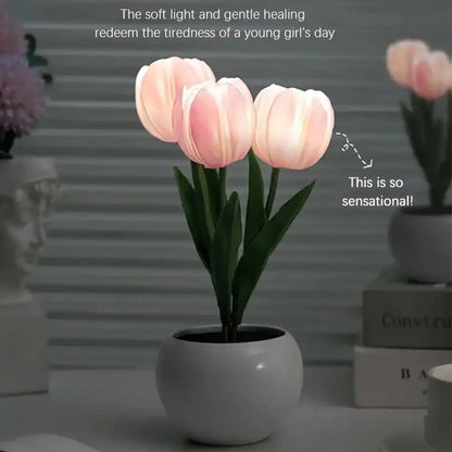 Pink tulips in a gray pot with text on a blurred background