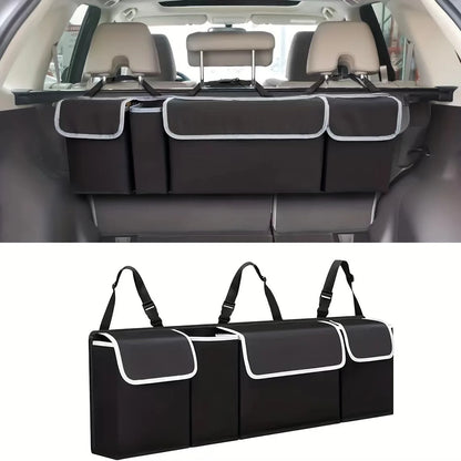 Car organizer with multiple compartments attached to a car's back seat.