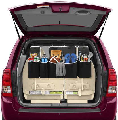 Car trunk with a cargo organizer holding various items on a white background