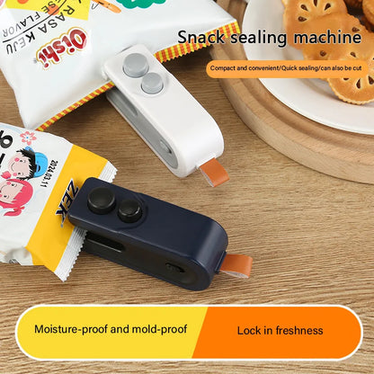 Snack sealing machine on a wooden surface with snack packages and cookies.