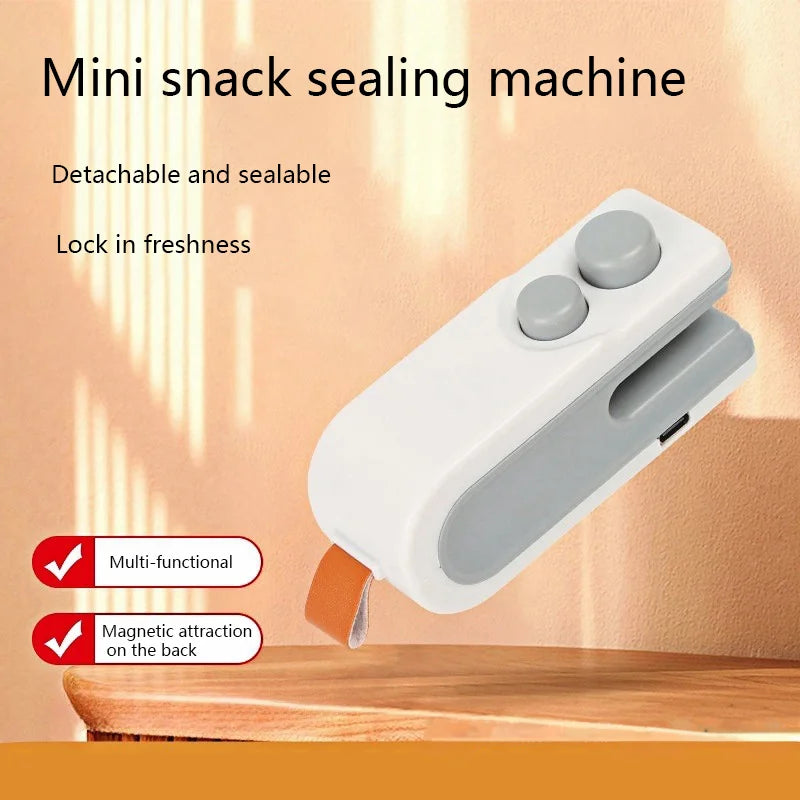 Mini snack sealing machine with text on a wooden surface