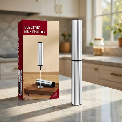 Electric milk frother with packaging on a kitchen counter