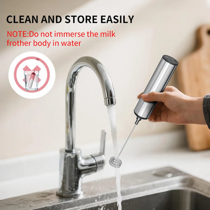 Hand using a milk frother under running water from a faucet with text about cleaning and storage.