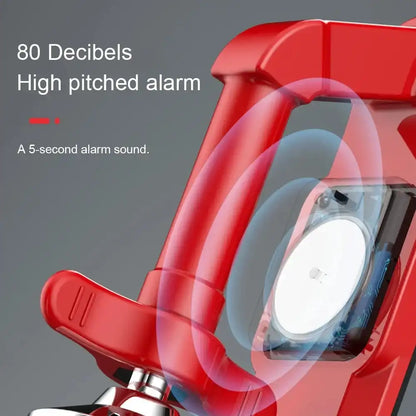 Red alarm clock with high-pitched alarm feature on a gray background