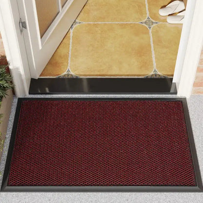 Red doormat on a gray floor with a tiled entranceway background