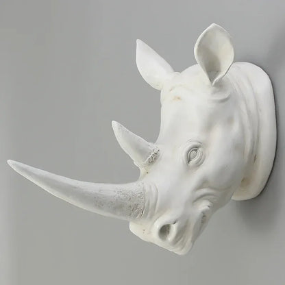 Rhino head wall sculpture displayed in a luxury hotel lobby as an eye-catching animal wall art centerpiece