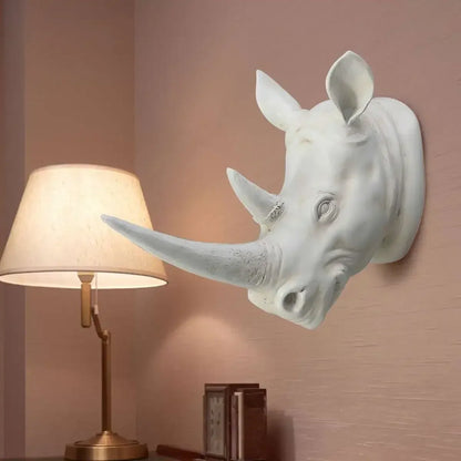 Rhino head wall sculpture displayed in a luxury hotel lobby as an eye-catching animal wall art centerpiece