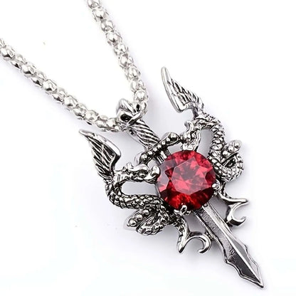 Silver pendant with red gemstone on a white background