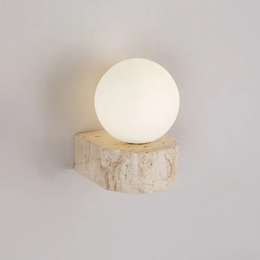 Spherical light fixture on a wooden base against a plain background
