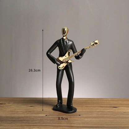 Statue of a person playing a guitar with dimensions indicated on a wooden surface and gray background