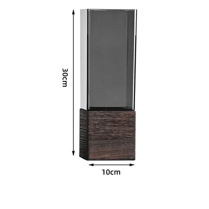 Tall dark glass container with wooden base and dimensions labeled on a white background