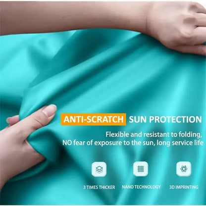Teal fabric with hands holding it, featuring text about anti-scratch sun protection.