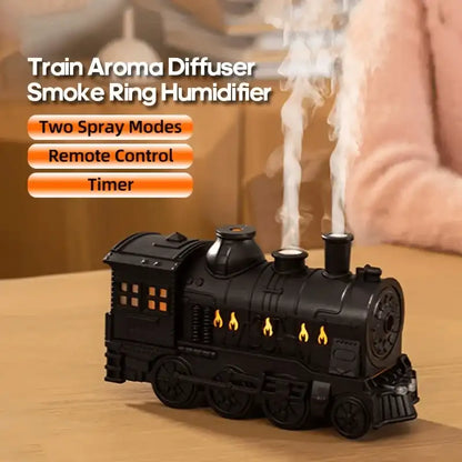 Train-shaped aroma diffuser with smoke ring humidifier on a wooden surface, featuring Kinscooter branding.
