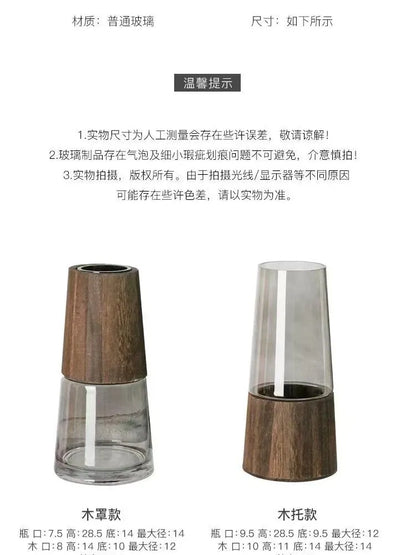 Two glass vases with wooden bases on a white background