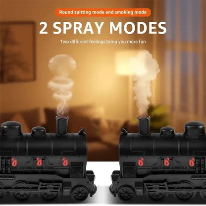 Two black train models with smoke effects on a blurred indoor background