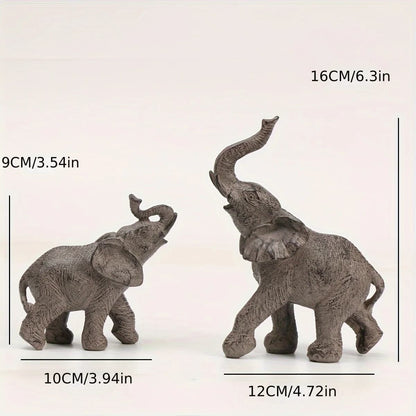 Two elephant figurines with measurements on a white background
