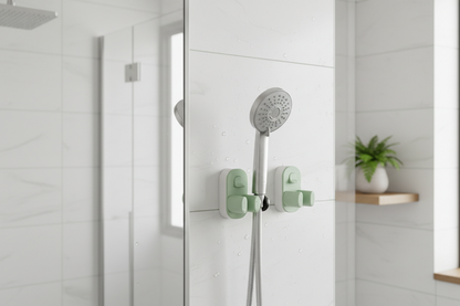 Universal adjustable shower bracket mounted on smooth bathroom tile wall holding a handheld showerhead