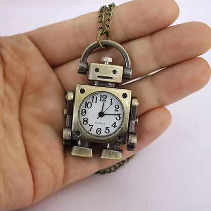 Vintage-style robot clock pendant held in a hand against a white background
