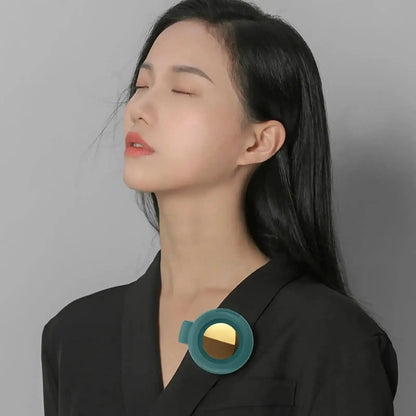 Woman wearing a black blazer with Mini Whirlwind Clip-On Portable Fan on a gray background