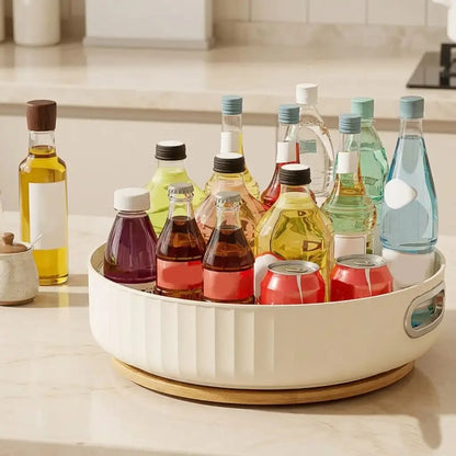 White and gold round tray with various bottles and containers on a kitchen counter.