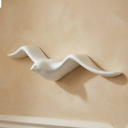 White ceramic Bird-shaped object on a beige background