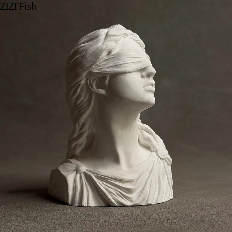 White marble bust of a draped figure with blindfold on a dark background