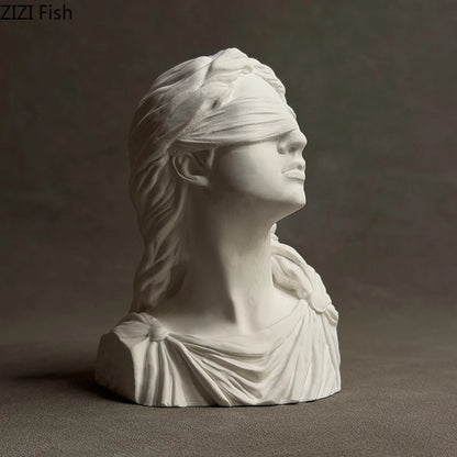 White marble bust of a draped figure with blindfold on a dark background